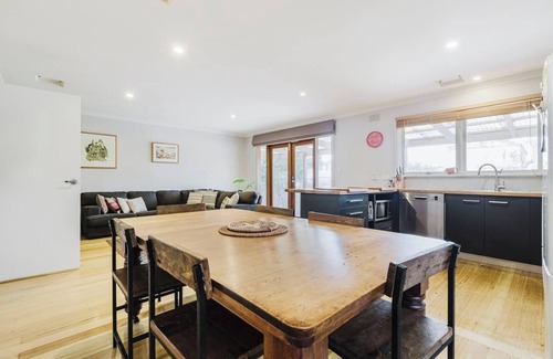 Kensington House | Tangerine Gleam Cheerful Inner City Family Abode