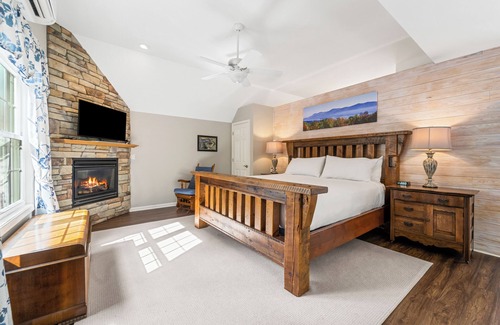 Lexington Bed & Breakfast | The Blue Ridge Cottage is a second floor room steps from the Main Inn. It has its own private deck and entrance which offer wooded and valley views. This cottage has a private 4 person Sundance Spa tub, and an outdoor propane fire pit. It features a