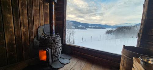 Vestre Slidre Apartment | The blue room at Vevstogo - cosy with a mesmerizing view, sauna and eco living in an old school house