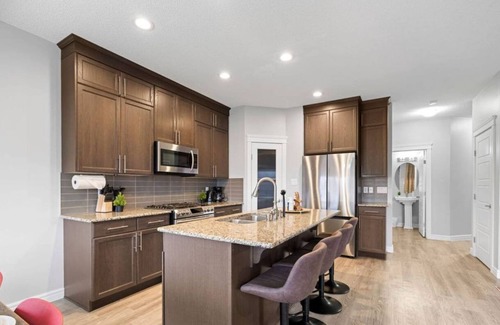 Southeast Edmonton House | The Canadiana | Games Room | Sleeps 11 | King Bed