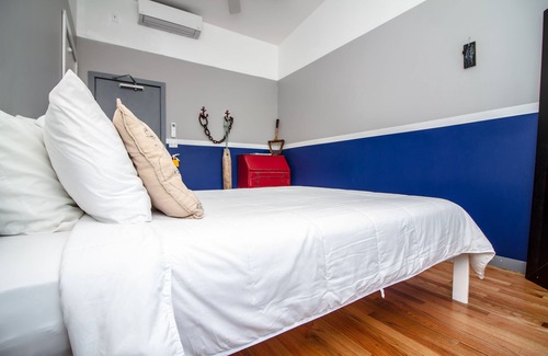Queens Condo | The High Tide Two Bedroom Suite #8 Hotel Room by RedAwning