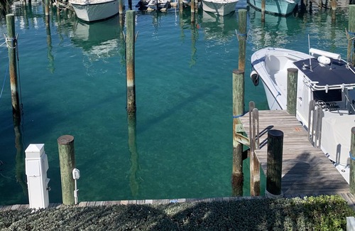 Palm Cay Apartment | The Marina Room is a guest room with an outstanding Marina view .