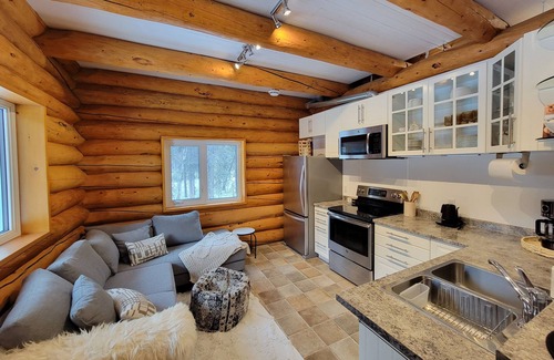 Whitehorse Cabin | The Meadow Cabin. Enjoy the Northern Lights from your bed or balcany.