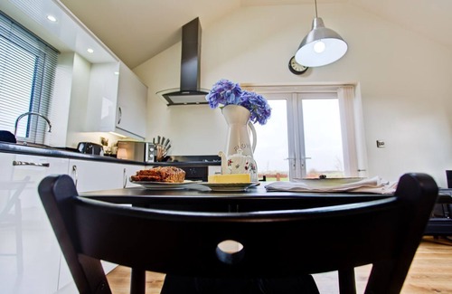 Rhoscolyn Apartment | The Old Dairy - a coastal that sleeps 2 guests in 1 bedroom