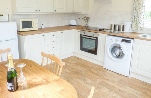 Christchurch Cottage | THE OLD DAIRY HOLIDAY COTTAGE, romantic, with a garden in Oakford