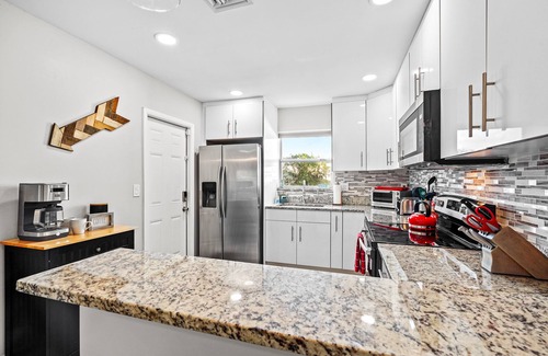Lantana House | The Surf Shack! Pool Home With Private Backyard Oasis. Close to Beach & Dining