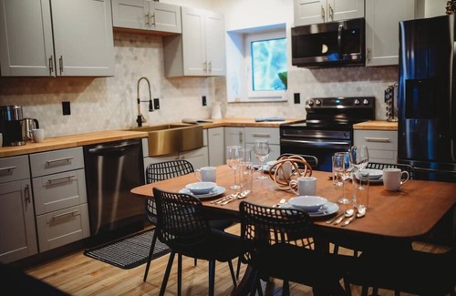 College Cabin | This beautiful log cottage has large windows that let in lots of light