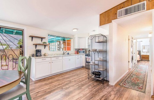 The Garden District Apartment | This centrally located 3 bedroom 2 bathroom features a full size pool and electric vehicle charging on site.