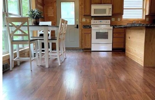Westby House | Timber Coulee Creek in backyard, king size bed, grill on deck, large garage.