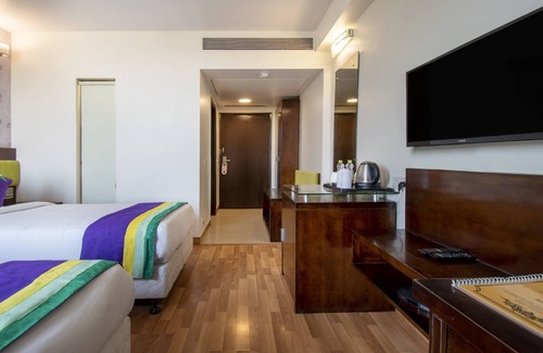 New Friends Colony Hotel | Treebo Premium Rose Mallow