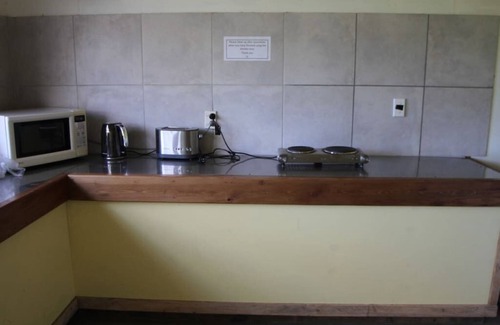 Mokihinui RV Rental | Treehouse at Cowshed cafe, Gentle Annie Camping Ground