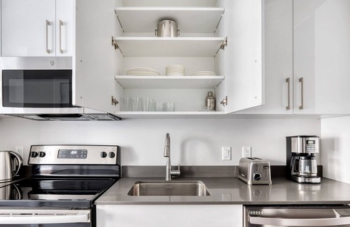 St. Elizabeth's Apartment | Trendy Brighton Studio w/W/D, Gym, near T, Shops + Dining, by Blueground