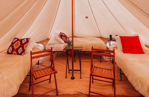 Valle House | Triple Tent w/ Shared Bathroom - Find us among the juniper trees and open sky.