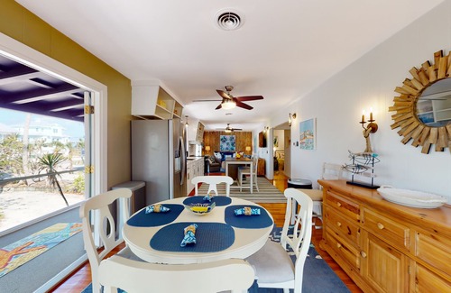 Palm Island House | Tropical Palm Island home steps from the beach with grill, outdoor shower, dock