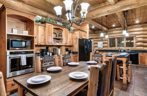 Pittman Center Cabin | True Log Cabin 2 acres, hot tub, fire pit, stream, all king suites