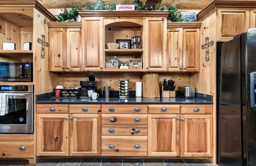 Pittman Center Cabin | True Log Cabin 2 acres, hot tub, fire pit, stream, all king suites