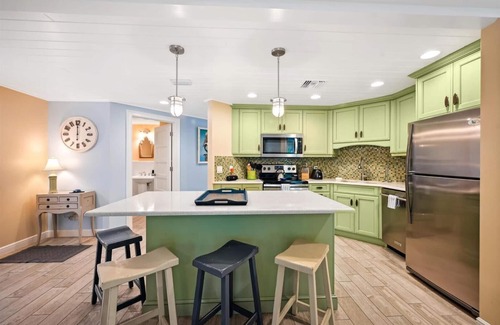 Holmes Beach Cottage | Two Bedroom Cottage with Tropical Landscaping Surrounding Private Heated Pool!
