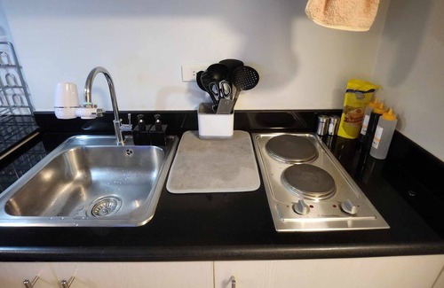 Valenzuela Condo | Ultimate Staycationnw/Jacuzzi and Arcade