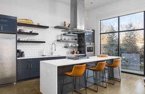 Urbandale Nations House | Unique Modern Ranch with Pool, Hot Tub, Grill & Fireplace