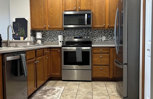 Blaine House | Unwind in style at our Cozy-lakefront townhome retreat. Conveniently located.