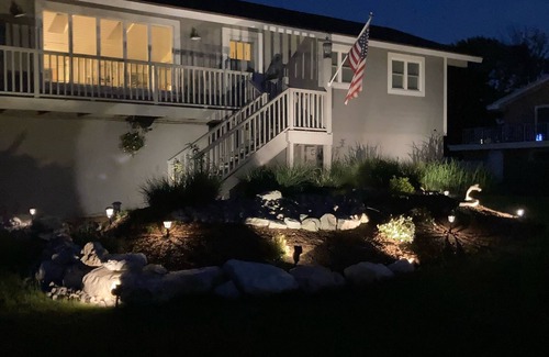 Ludington House | Upper level rental with large family room and huge wrap around deck full kitchen