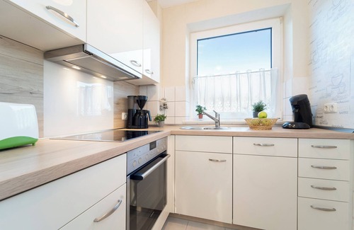 Lutt Kiepenbarg Apartment | Vacation apartment Kleiner Strandpirat in the apartment complex Wennseestraße