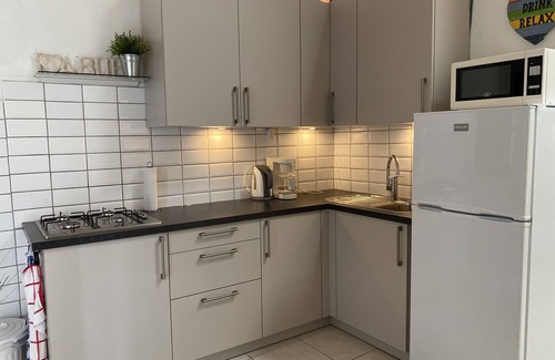 Camacuri Apartment | Vacation home with hotel service in sunny garden with pool, close to beach
