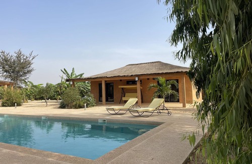 Nianing House | Villa Assinie, a privileged space around a 16 m Californian swimming pool