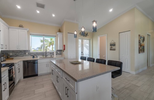 Breezeswept Beach Estates House | Villa Lucie | Canalfront home w/5 bedrooms + pool + boat lift