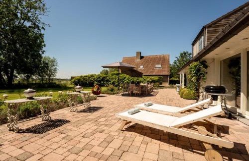 De Haan Villa | Villa Villa Rosetree with sauna and pool table by Interhome