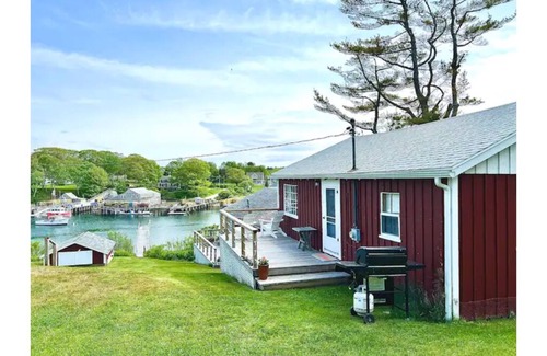 New Harbor Cottage | Vintage cabin perched on edge of harbor with dock