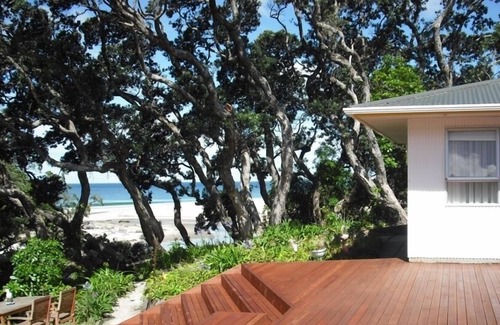 Whiritoa House | Walk straight onto the sand from the garden.