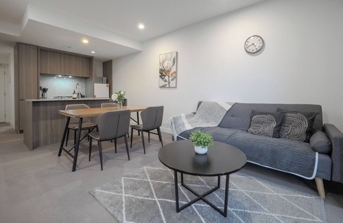 Carlton South Apartment | Walk through the art-filled lobby, and you'll find a full range of resident amenities, with pools and gym, neighbour to the world-renowned Royal Melbourne Institute of Technology (RMIT).