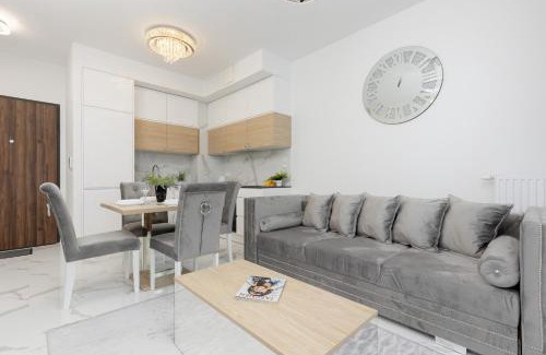 Wilanow Apartment | Warsaw Sarmacka Apartment with Gym, Sauna and Parking by Noclegi Renters