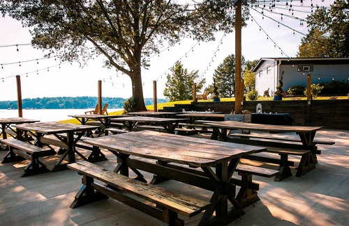 Steele Creek House | Waterfront, 100- Year-old Wood Cabin #16 at Long Cove Resort by Redawning