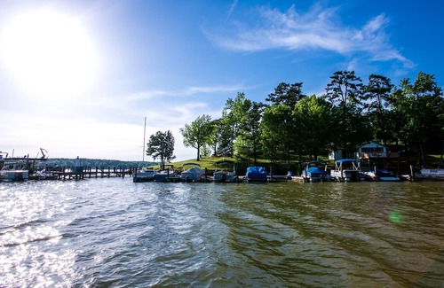 Steele Creek House | Waterfront, 100- Year-old Wood Cabin #16 at Long Cove Resort by Redawning