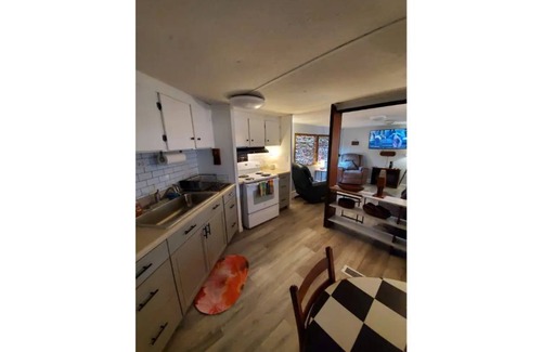 Satsuma Cottage | Waterfront Boat House updated mobile home - Work & Fish on 50 ft. Dock and slips