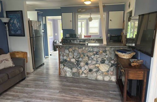 Elk Rapids Cottage | Waterfront cottage in Elk Rapids on Bass Lake. Firepit Pet ok
