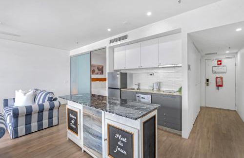 Cairns Central Business District Apartment | Waters Edge at Harbour Lights - Poolside Convenience