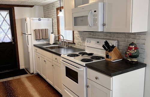 Pocono Lake Ski Chalet | Waterview, air conditioning, adjacent to the beach, covered front and rear decks