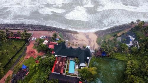Varkala Hotel | West Bay Palm TreeHeritage Beach Resort