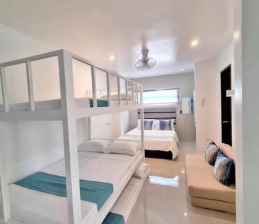 Manoc-Manoc Apartment | White Beachfront Apartment By Anna