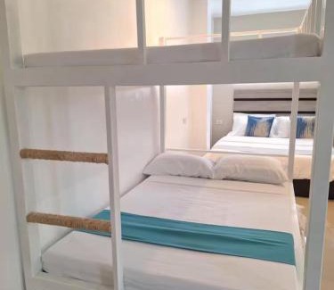 Manoc-Manoc Apartment | White Beachfront Apartment By Anna