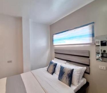 Manoc-Manoc Apartment | White Beachfront Apartment By Anna