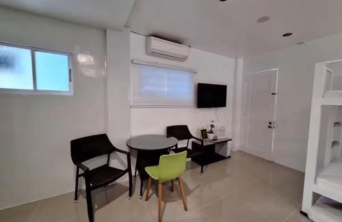 Manoc-Manoc Apartment | White Beachfront Apartment By Anna