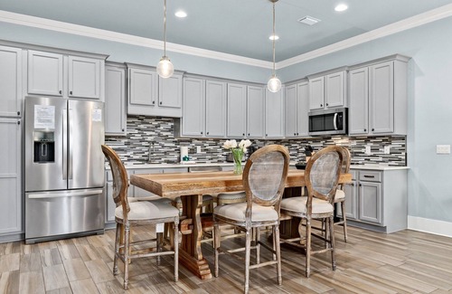 Miramar Beach House | White Coral Chateau with Low-Speed Vehicle, Heated Pool, and Cornhole Field
