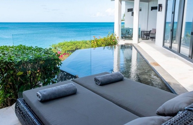 2 bedroom modern villa with stunning views overlooking the beach in Tamarind Hills