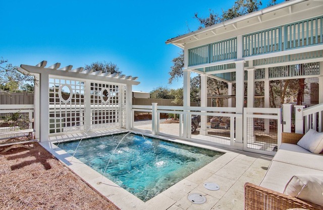 2 minute walk to the Beach. Private Heated Pool. New 2024 6 Seater Golf Cart.