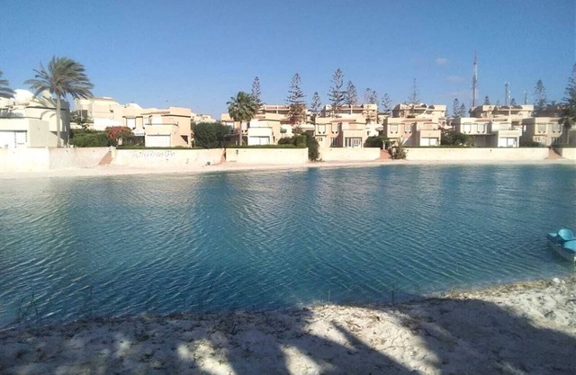 2 stories - 3 BR Villa + private garden by Lake+sea. close to Marina& Alamein