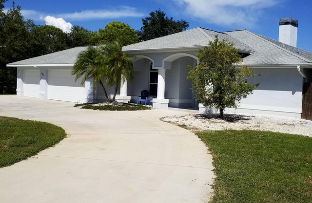 3 bedroom 3 bath house with private heated screened pool on a quiet cul de sac